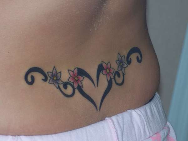 lower back tattoos,women with lower back tattoo,lower back tattoo ...