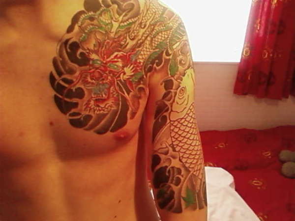 japanese dragon sleeve,japanese dragon sleeve tattoo designs,japanese dragon sleeve tattoos for men,japanese dragon half sleeve tattoo