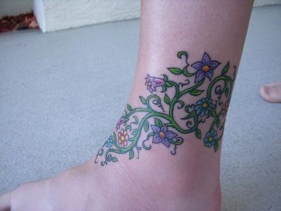 flower anklet tattoos,cool flower ankle tattoo designs,lovely ankle tattoos for women,ankle flower tattoo designs images,anklet floral tattoos