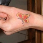 butterfly hand tattoo designs,butterfly hand tattoos for women,hand tattoo designs,tattoo of butterfly on hand