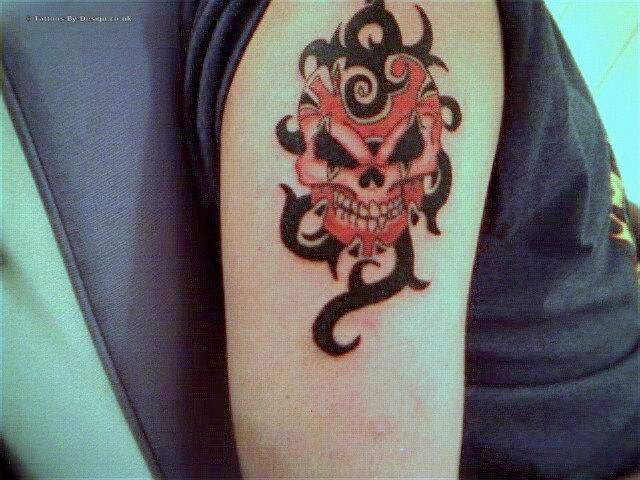 skull tattoo designs,tribal tattoo designs,tribal skull tattoos,skull tribal tattoo designs