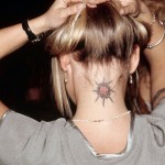 Sun Tattoo on Woman's Neck