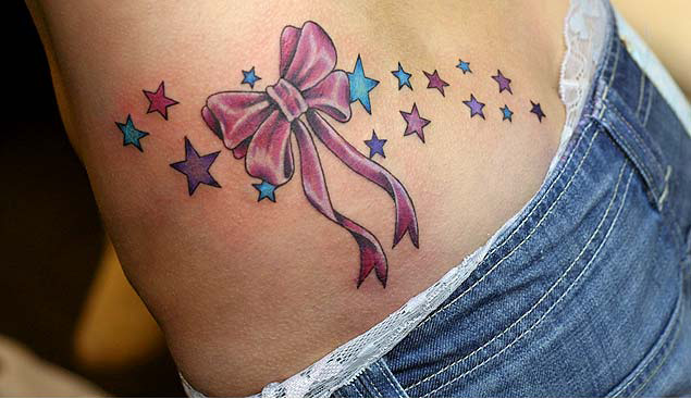 Awesome Lower Back Star Tattoos Pictures