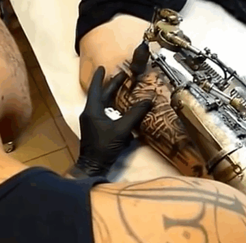 prosthetic-arm-tattoo-artist-jc-sheitan-tenet-jl-gonzal-1